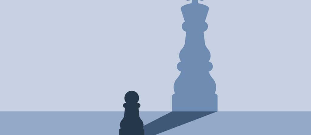 Strategic chess game with a focus on king and queen pieces on a blue background.