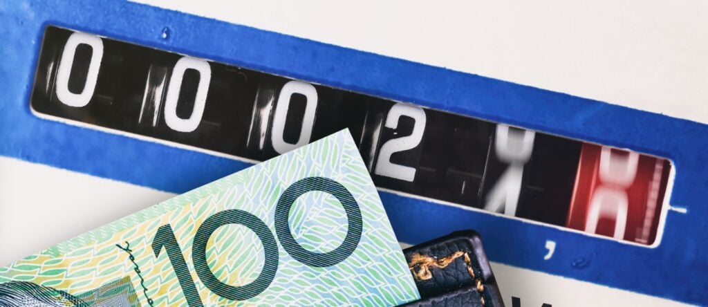 High-quality Australian currency notes and a coin counter machine for cash handling.